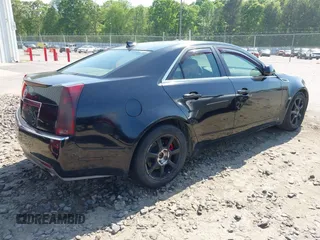 2009 Cadillac CTS RWD w/1SA with VIN 1G6DF577390128796, listed as a IAAI auction lot 42078153 with 257,757 mi miles. Bid and sale history available at carsss.com. Image 4.