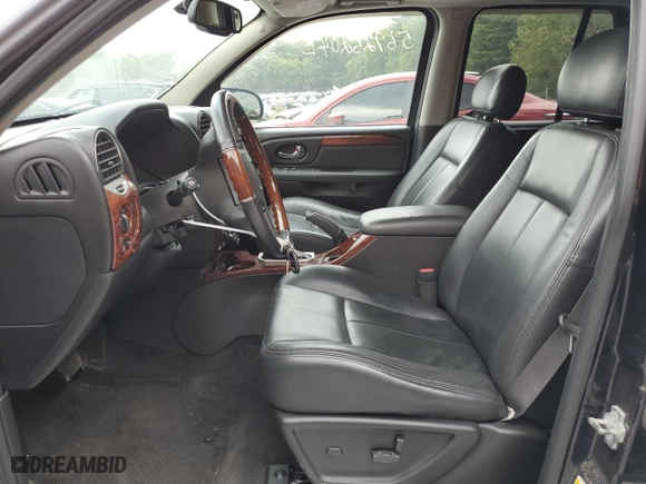 2007 GMC Envoy Denali with VIN 1GKET63M272293627, listed as a Copart auction lot 56926204 with 169,982 mi miles and Salvage Title. Bid and sale history available at carsss.com. Image 7.