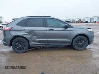 2023 Ford Edge SE z VIN 2FMPK4G95PBA41278, wystawiony jako IAAI lot #41964995 z przebiegiem 21 079 mil mil oraz . Historia ofert i sprzedaży dostępna na DreamBid. Obrazek 6.