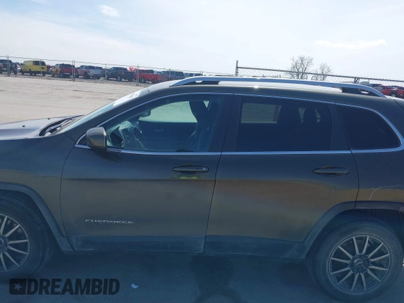 2015 Jeep Cherokee North with VIN 1C4PJMCS9FW588826, listed as a IAAI auction lot 41952883 with 145,586 mi miles. Bid and sale history available at carsss.com. Image 15.