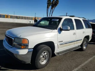 2001 GMC Yukon SLT with VIN 1GKEC13T61R225145, listed as a Copart auction lot 79885564 with 144,846 mi miles and Salvage Title. Bid and sale history available at carsss.com. Image 1.