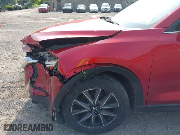 2018 Mazda CX-5 Grand Touring with VIN JM3KFBDM2J0448555, listed as a IAAI auction lot 42449282 with 65,770 mi miles and . Bid and sale history available at DreamBid. Image 6.