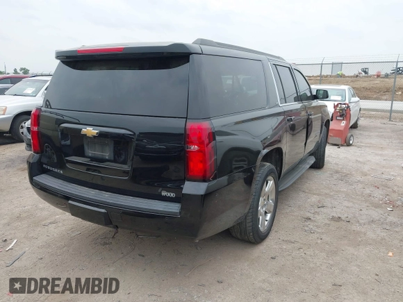 2015 Chevrolet Suburban LT with VIN 1GNSCJKC1FR304656, listed as a IAAI auction lot 42071124 with 133,140 mi miles. Bid and sale history available at carsss.com. Image 4.