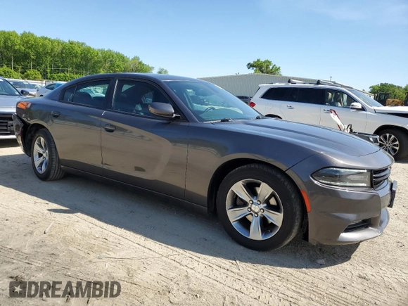 2015 Dodge Charger SXT with VIN 2C3CDXHG8FH794623, listed as a Copart auction lot 52000144 with 145,624 mi miles and Salvage Title. Bid and sale history available at DreamBid. Image 4.