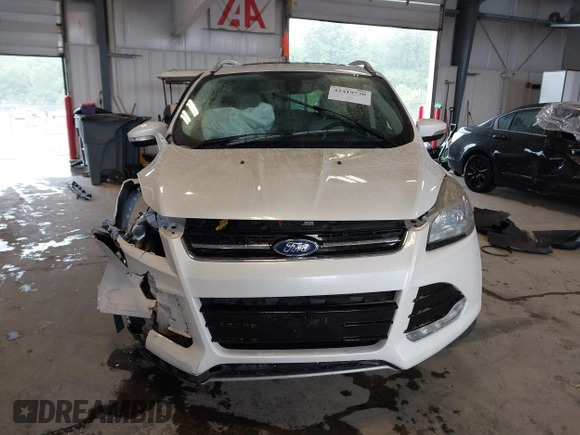 2016 Ford Escape Titanium with VIN 1FMCU9J90GUA18743, listed as a IAAI auction lot 42419730 with 102,666 mi miles and . Bid and sale history available at DreamBid. Image 13.