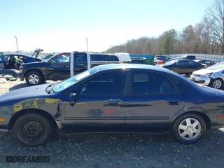 1998 Ford Taurus LX with VIN 1FAFP52U0WA226924, listed as a IAAI auction lot 41702083 with 55,998 mi miles. Bid and sale history available at carsss.com. Image 6.