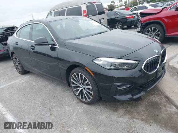 2021 BMW 2 Series 228i with VIN WBA53AK04M7H59327, listed as a IAAI auction lot 41879591 with 13,855 mi miles. Bid and sale history available at carsss.com. Image 1.