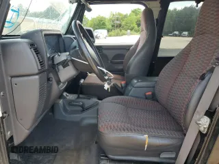 1999 Jeep Wrangler Sport with VIN 1J4FY19S9XP423684, listed as a Copart auction lot 55079455 with 149,756 mi miles and Salvage Title. Bid and sale history available at carsss.com. Image 7.