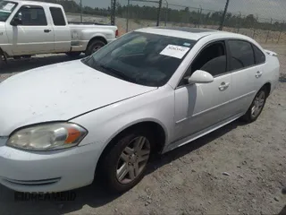 2014 Chevrolet Impala LT with VIN 2G1WB5E30E1136153, listed as a IAAI auction lot 39848599 with 126,676 mi miles and . Bid and sale history available at DreamBid. Image 2.