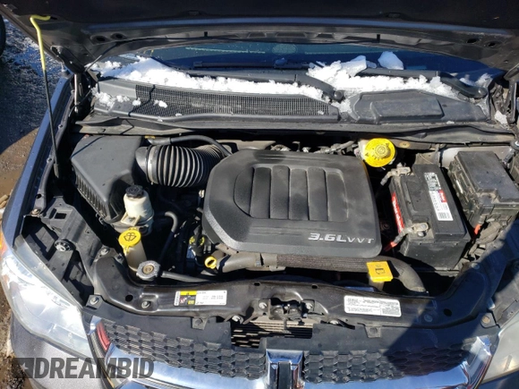 2018 Dodge Grand Caravan SXT with VIN 2C4RDGCGXJR325632, listed as a Copart auction lot 46326655 with 128,692 mi miles and Clean Title. Bid and sale history available at DreamBid. Image 12.