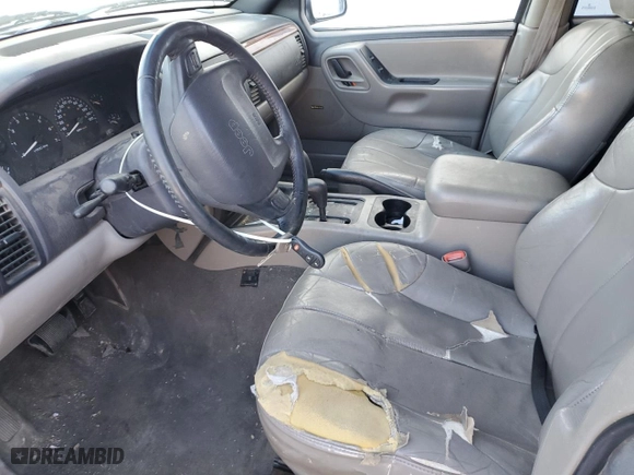 1999 Jeep Grand Cherokee Laredo with VIN 1J4GW58N9XC730311, listed as a Copart auction lot 77774544 with 0 mi miles and Salvage Title. Bid and sale history available at carsss.com. Image 7.