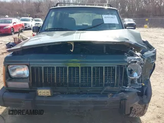 1996 Jeep Cherokee Sport with VIN 1J4FJ68S2TL299150, listed as a IAAI auction lot 41932867 with 142,761 mi miles. Bid and sale history available at carsss.com. Image 6.