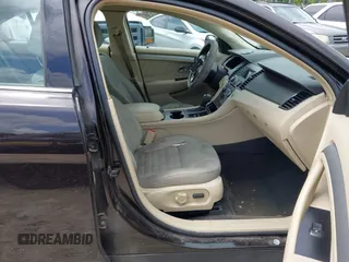 2014 Ford Taurus SE z VIN 1FAHP2D81EG140072, wystawiony jako IAAI lot #42124900 z przebiegiem 116 560 mil mil oraz . Historia ofert i sprzedaży dostępna na DreamBid. Obrazek 5.