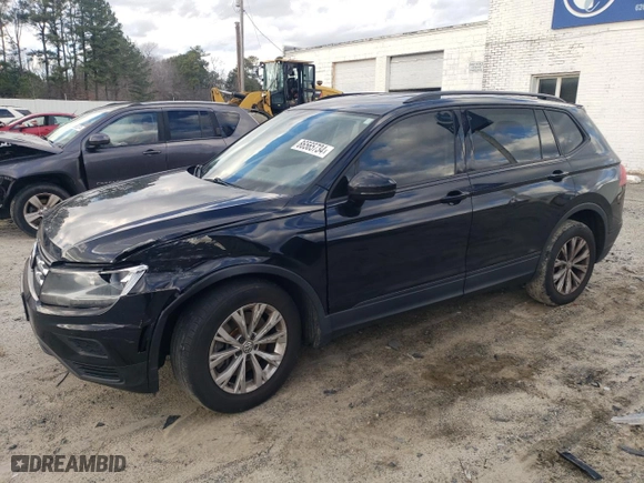 2018 Volkswagen Tiguan S with VIN 3VV1B7AXXJM105874, listed as a Copart auction lot 86565734 with 100,901 mi miles and Salvage Title. Bid and sale history available at carsss.com. Image 1.