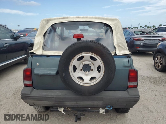 1994 Geo Tracker z VIN 2CNBE18U1R6918878, wystawiony jako Copart lot #75894834 z przebiegiem Nie podano mil oraz Nie do naprawy. Historia ofert i sprzedaży dostępna na DreamBid. Obrazek 6.
