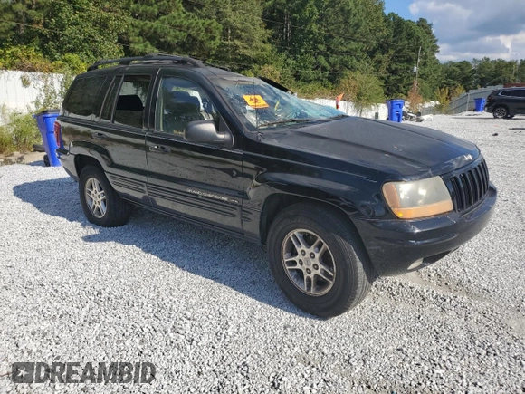 2000 Jeep Grand Cherokee Laredo with VIN 1J4G258S5YC193875, listed as a Copart auction lot 74731704 with Not provided miles and Salvage title. Bid and sale history available at DreamBid. Image 4.