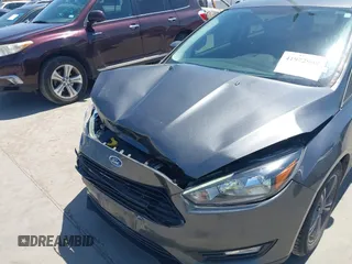 2018 Ford Focus SE with VIN 1FADP3FE3JL204220, listed as a IAAI auction lot 41972960 with 62,682 mi miles and . Bid and sale history available at DreamBid. Image 6.
