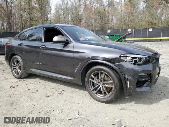 2019 BMW X4 M40i with VIN 5UXUJ5C5XKLJ64004, listed as a Copart auction lot 52106895 with 74,599 mi miles and Salvage title. Bid and sale history available at DreamBid. Image 4.
