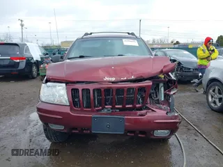 1999 Jeep Grand Cherokee Limited with VIN 1J4GW68N5XC642670, listed as a IAAI auction lot 41990199 with 154,492 mi miles. Bid and sale history available at carsss.com. Image 6.