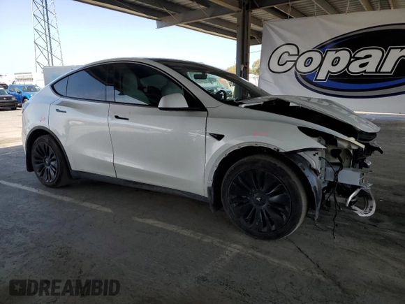 2023 Tesla Model Y Long Range with VIN 7SAYGDEE8PF620703, listed as a Copart auction lot 54655105 with 29,538 mi miles and Salvage Title. Bid and sale history available at DreamBid. Image 4.