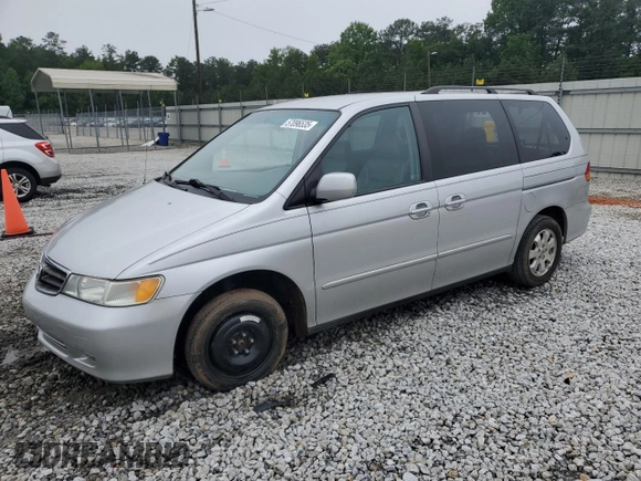2004 Honda Odyssey EX-L with VIN 5FNRL18044B069774, listed as a Copart auction lot 57096535 with 165,307 mi miles and Salvage title. Bid and sale history available at DreamBid. Image 1.