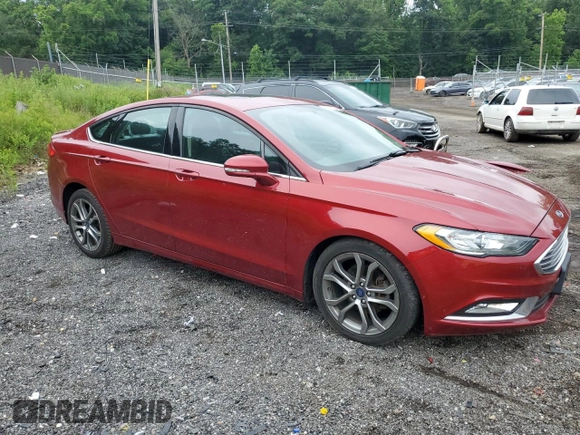 2017 Ford Fusion SE with VIN 3FA6P0H74HR197800, listed as a Copart auction lot 61042735 with 128,125 mi miles and Salvage title. Bid and sale history available at DreamBid. Image 4.