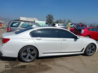 2019 BMW 7 Series 750i with VIN WBA7F0C5XKGM25771, listed as a IAAI auction lot 42167614 with 73,692 mi miles. Bid and sale history available at carsss.com. Image 13.