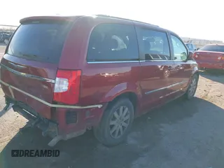 2013 Chrysler Town & Country Touring with VIN 2C4RC1BG2DR758951, listed as a IAAI auction lot 41136184 with 134,784 mi miles. Bid and sale history available at carsss.com. Image 4.