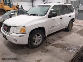 2004 GMC Envoy SLE with VIN 1GKDT13S042173138, listed as a IAAI auction lot 41340595 with 111,282 mi miles. Bid and sale history available at carsss.com. Image 2.