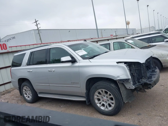 2015 GMC Yukon SLT z VIN 1GKS1BKC0FR172661, wystawiony jako IAAI lot #41911331 z przebiegiem 171 815 mil mil oraz . Historia ofert i sprzedaży dostępna na DreamBid. Obrazek 14.