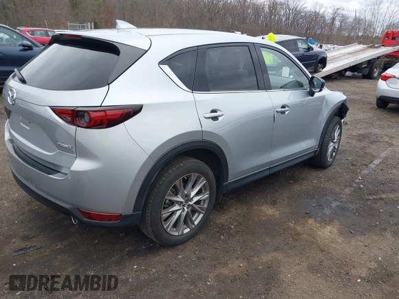 2020 Mazda CX-5 Grand Touring with VIN JM3KFBDM4L0843825, listed as a IAAI auction lot 41733575 with 18,800 mi miles. Bid and sale history available at carsss.com. Image 4.