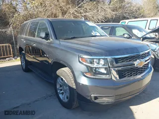 2020 Chevrolet Tahoe LT with VIN 1GNSCBKCXLR309128, listed as a IAAI auction lot 41641948 with 104,571 mi miles. Bid and sale history available at carsss.com. Image 1.