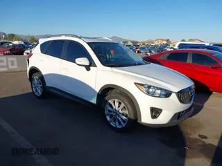 2015 Mazda CX-5 Grand Touring with VIN JM3KE2DYXF0493370, listed as a IAAI auction lot 42087156 with 161,464 mi miles. Bid and sale history available at carsss.com. Image 1.