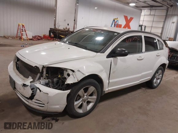 2010 Dodge Caliber SXT with VIN 1B3CB4HA3AD590654, listed as a IAAI auction lot 41814572 with 203,422 mi miles and . Bid and sale history available at DreamBid. Image 18.