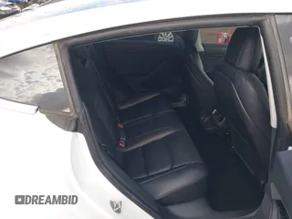 2019 Tesla Model 3 Long Range with VIN 5YJ3E1EBXKF512710, listed as a IAAI auction lot 42063737 with 90,721 mi miles and . Bid and sale history available at DreamBid. Image 8.