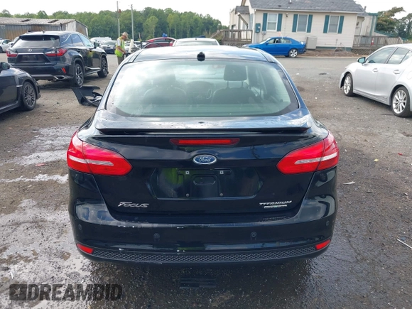 2016 Ford Focus Titanium z VIN 1FADP3J27GL215436, wystawiony jako IAAI lot #42709166 z przebiegiem 75 956 mil mil oraz . Historia ofert i sprzedaży dostępna na DreamBid. Obrazek 17.