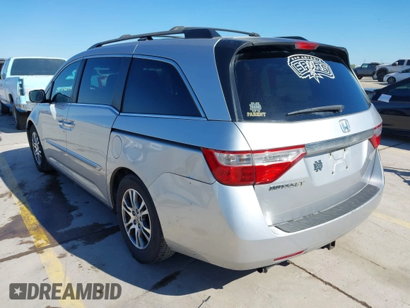 2012 Honda Odyssey EX with VIN 5FNRL5H48CB131881, listed as a IAAI auction lot 41822159 with 354,718 mi miles and . Bid and sale history available at DreamBid. Image 3.