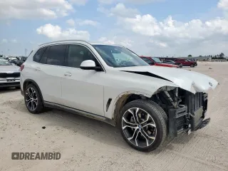 2021 BMW X5 sDrive40i with VIN 5UXCR4C06M9F56578, listed as a Copart auction lot 58218315 with 69,927 mi miles and Salvage title. Bid and sale history available at DreamBid. Image 4.