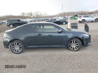 2015 Scion tC with VIN JTKJF5C7XFJ001662, listed as a IAAI auction lot 41843123 with 128,851 mi miles. Bid and sale history available at carsss.com. Image 13.