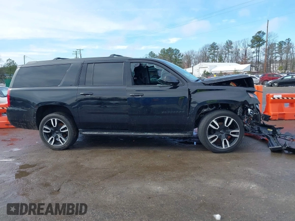 2020 Chevrolet Suburban LT z VIN 1GNSKHKC3LR170868, wystawiony jako IAAI lot #41575519 z przebiegiem 131 080 mil mil oraz . Historia ofert i sprzedaży dostępna na DreamBid. Obrazek 13.