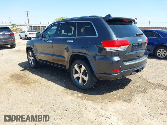 2015 Jeep Grand Cherokee Overland with VIN 1C4RJECG3FC635327, listed as a IAAI auction lot 41910559 with 118,519 mi miles and . Bid and sale history available at DreamBid. Image 3.