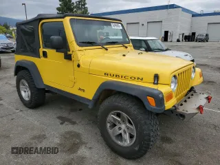 2004 Jeep Wrangler Rubicon with VIN 1J4FA69SX4P768963, listed as a Copart auction lot 56999665 with 91,949 mi miles and Salvage title. Bid and sale history available at DreamBid. Image 4.