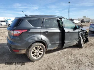 2018 Ford Escape SE with VIN 1FMCU9GD6JUB12810, listed as a Copart auction lot 82598864 with 138,640 mi miles and Salvage Title. Bid and sale history available at carsss.com. Image 3.