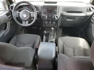2015 Jeep Wrangler Unlimited Sport with VIN 1C4BJWDG4FL766904, listed as a Copart auction lot 58126555 with 68,400 mi miles and Salvage title. Bid and sale history available at DreamBid. Image 8.