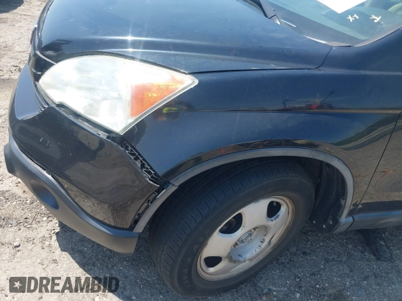 2007 Honda CR-V LX with VIN 5J6RE38377L000654, listed as a IAAI auction lot 42031455 with 112,869 mi miles. Bid and sale history available at carsss.com. Image 12.