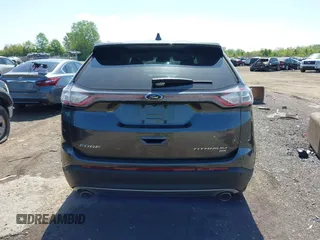 2015 Ford Edge Titanium z VIN 2FMPK4K83FBB30411, wystawiony jako IAAI lot #42230235 z przebiegiem 69 094 mil mil oraz . Historia ofert i sprzedaży dostępna na DreamBid. Obrazek 17.