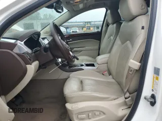 2013 Cadillac SRX Performance Collection z VIN 3GYFNHE33DS602428, wystawiony jako Copart lot #55688555 z przebiegiem 143 504 mil mil oraz Szkody całkowita. Historia ofert i sprzedaży dostępna na DreamBid. Obrazek 7.