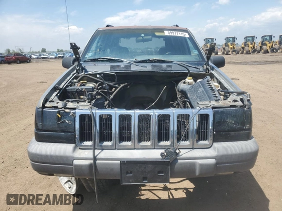 1997 Jeep Grand Cherokee Laredo z VIN 1J4GZ58S6VC636803, wystawiony jako Copart lot #59977115 z przebiegiem Nie podano mil oraz Szkoda całkowita • Salvage title. Historia ofert i sprzedaży dostępna na DreamBid. Obrazek 5.