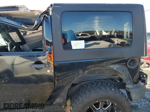 2015 Jeep Wrangler Willys Wheeler with VIN 1C4AJWAG8FL648645, listed as a Copart auction lot 74334884 with Not provided miles and Salvage title. Bid and sale history available at DreamBid. Image 12.