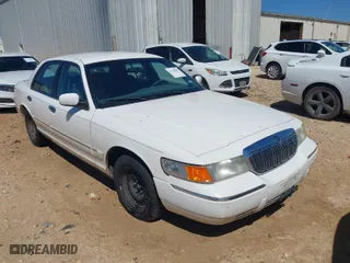 1999 Mercury Grand Marquis GS with VIN 2MEFM74W1XX719306, listed as a IAAI auction lot 41746901 with 165,436 mi miles. Bid and sale history available at carsss.com. Image 1.